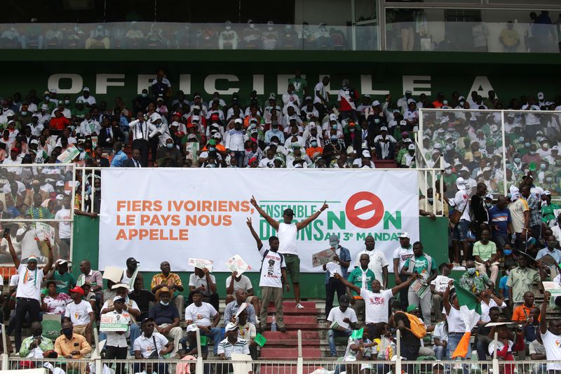 Supporters of Ivory Coast's opposition coalition parties gather during a stadium rally, in Abidjan