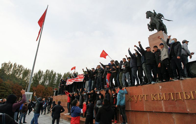 Demonstrators from rival political groups attend a rally in Bishkek