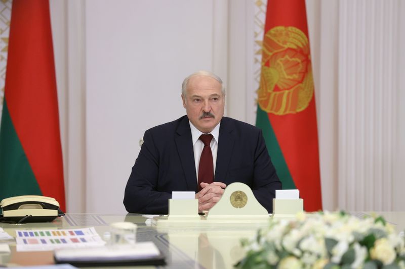 FILE PHOTO: Belarusian President Lukashenko attends a meeting in Minsk