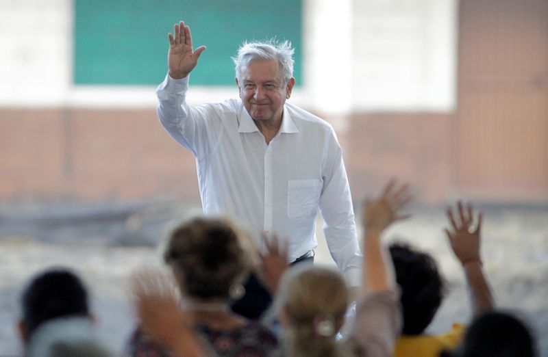 FILE PHOTO: Mexico's President Andres Manuel Lopez Obrador waves during a meeting with relatives of the 65 miners who died during an explosion at Pasta de Conchos coal mine, in San Juan de Sabinas