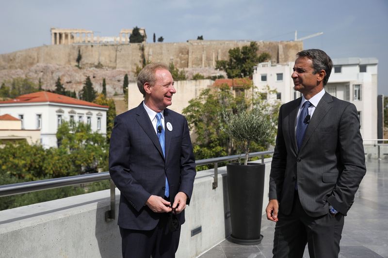 President of Microsoft Brad Smith speaks with Greek Prime Minister Kyriakos Mitsotakis in Athens