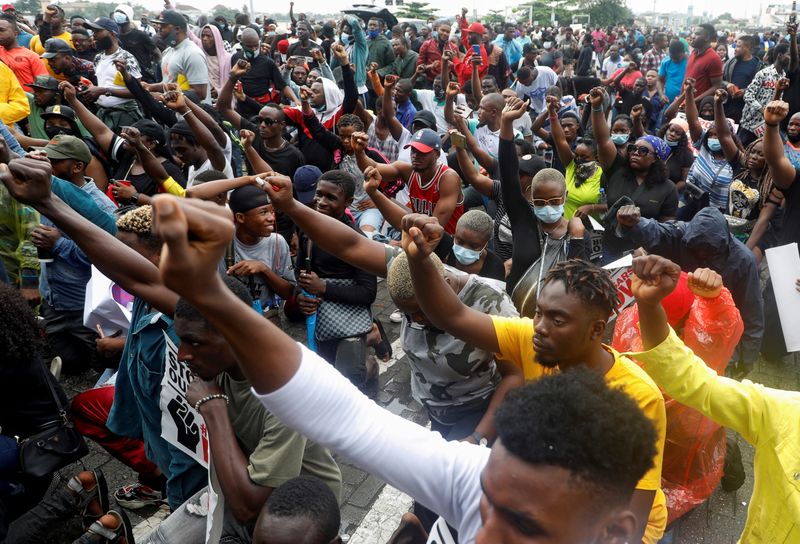 FILE PHOTO: Demonstrators gesture during a protest over alleged police brutality, in Lagos