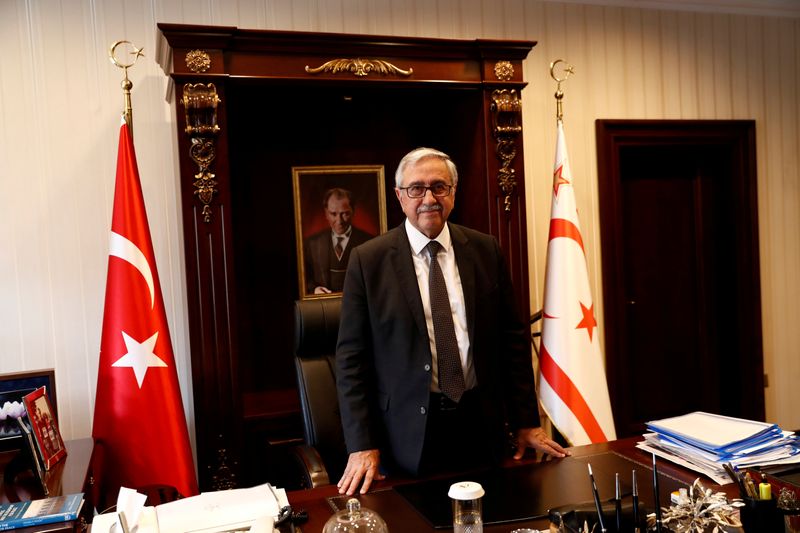 FILE PHOTO: Turkish Cypriot leader Akinci poses at his office in Nicosia