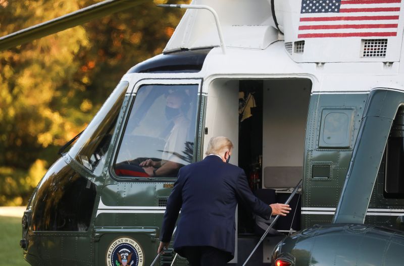 FILE PHOTO: U.S. President Trump boards the Marine One helicopter as he departs for Walter Reed Medical Center from the White House in Washington