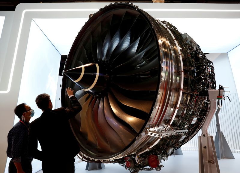FILE PHOTO: A man looks at Rolls Royce's Trent Engine displayed at the Singapore Airshow in Singapore