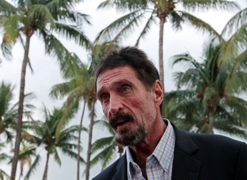 FILE PHOTO: Computer software pioneer McAfee speaks with reporters outside his hotel in Miami Beach