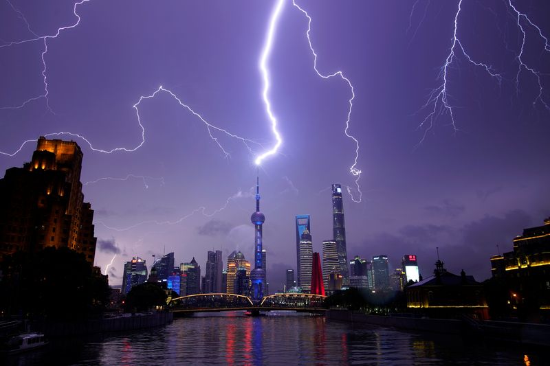 Lightning strikes are seen above the skyline of Shanghai's financial district of Pudong