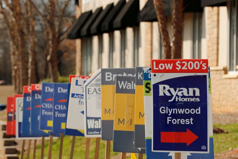 FILE PHOTO: Real estate signs advertise new homes for sale in multiple new developments in York County, South Carolina