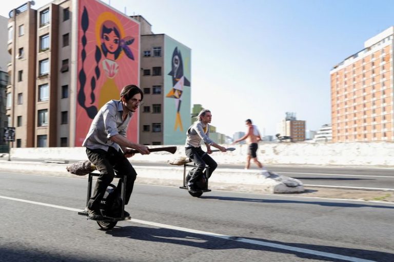 Brazilian duo glide through Sao Paulo streets with broomsticks for Muggles