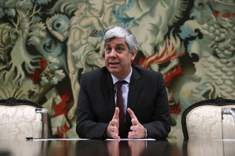 FILE PHOTO: Portugal's Finance Minister and Eurogroup President Mario Centeno gestures during an interview with Reuters in Lisbon