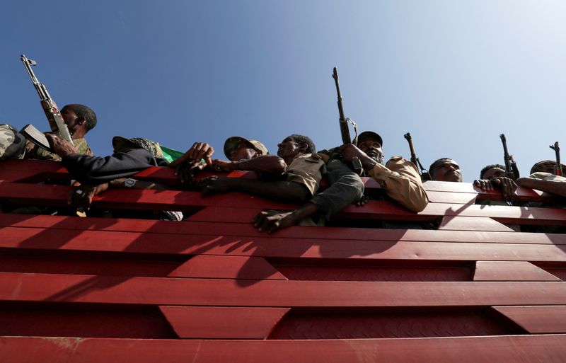 FILE PHOTO: Militia members from Ethiopia's Amhara region ride on their truck as they head to face the Tigray People's Liberation Front (TPLF), in Sanja, Amhara
