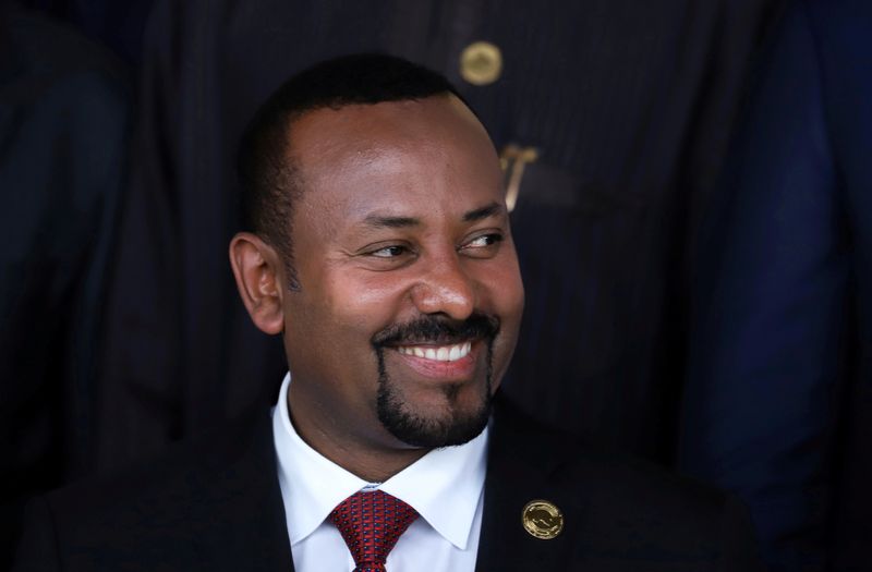 FILE PHOTO: Ethiopia's Prime Minister Abiy Ahmed poses for a photograph during the opening of the 33rd Ordinary Session of the Assembly of the Heads of State and the Government of the African Union (AU) in Addis Ababa