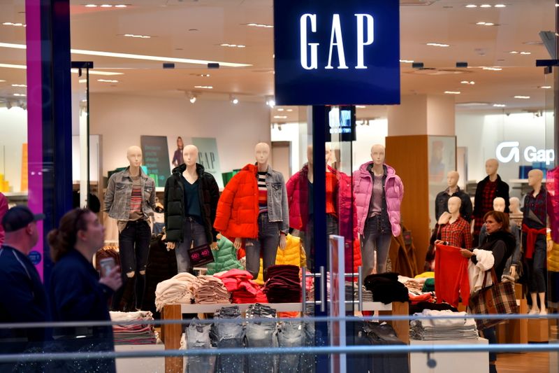 FILE PHOTO: A woman shops at a Gap store as holiday shopping accelerates at the King of Prussia Mall