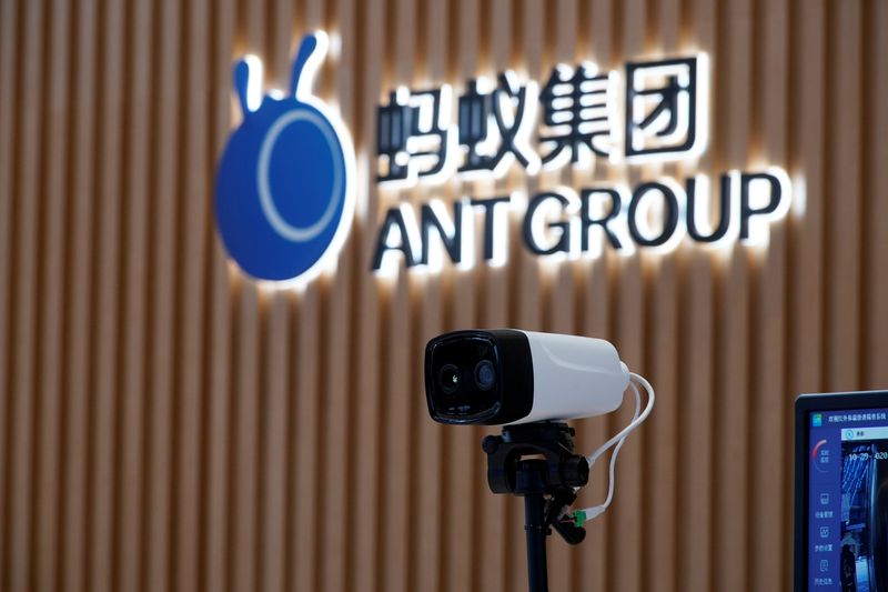 FILE PHOTO: A thermal imaging camera is seen in front of a logo of Ant Group at the headquarters of Ant Group, an affiliate of Alibaba, in Hangzhou