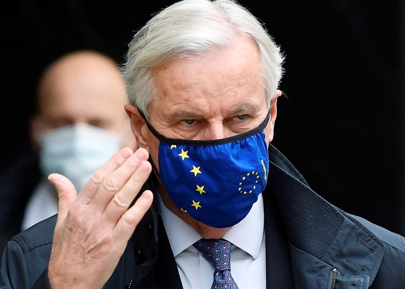 European Union's chief Brexit negotiator Michel Barnier wearing a face mask walks to Brexit trade negotiations in London