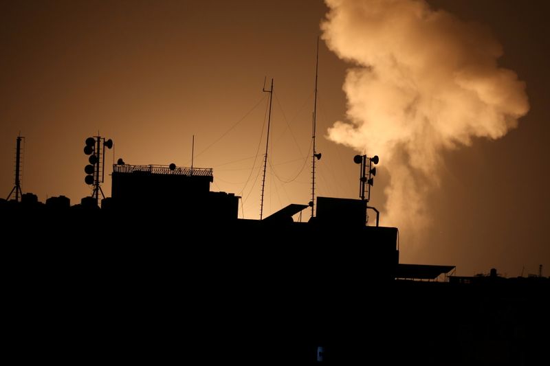 Smoke rises following an Israeli air strike in Gaza Strip