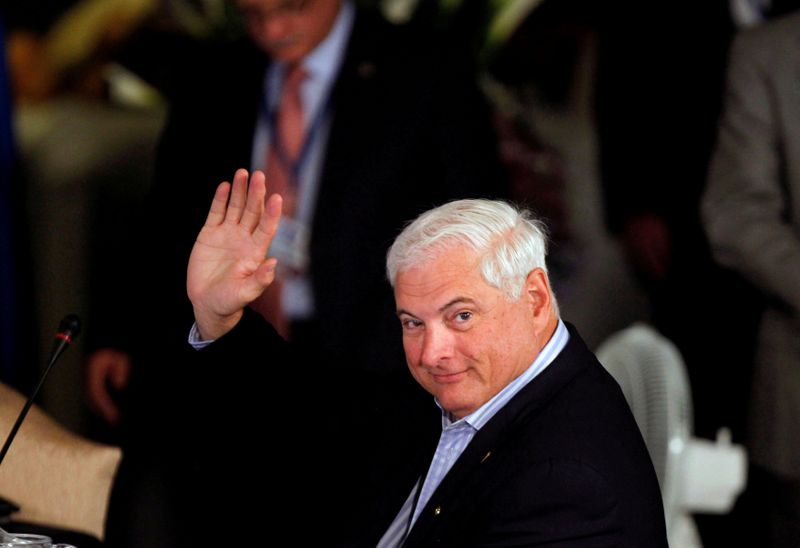 FILE PHOTO: Panamanian President Ricardo Martinelli waves during an anti-drugs summit at the Santo Domingo Hotel in Antigua