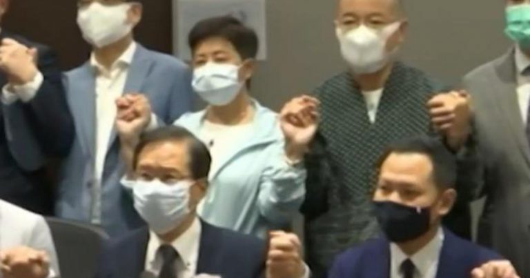 Pro-democracy lawmakers in Hong Kong resign en masse amid crackdown by Beijing