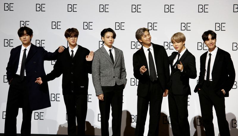 FILE PHOTO: Members of K-pop boy band BTS pose for photographs during a news conference promoting their new album 