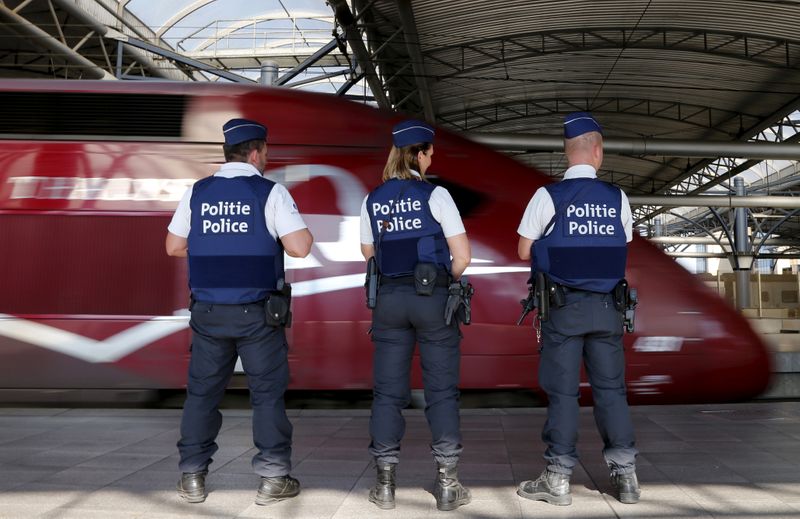 FILE PHOTO: Belgian police officers stand guard on a platform at the Thalys high-speed train terminal at Brussels Midi/Zuid railway station