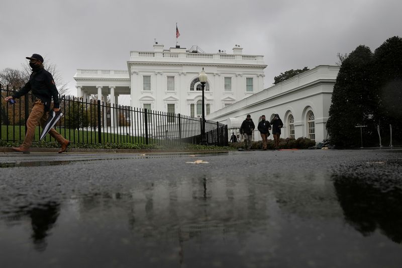 FILE PHOTO: Rain falls over the White House during a storm in Washington