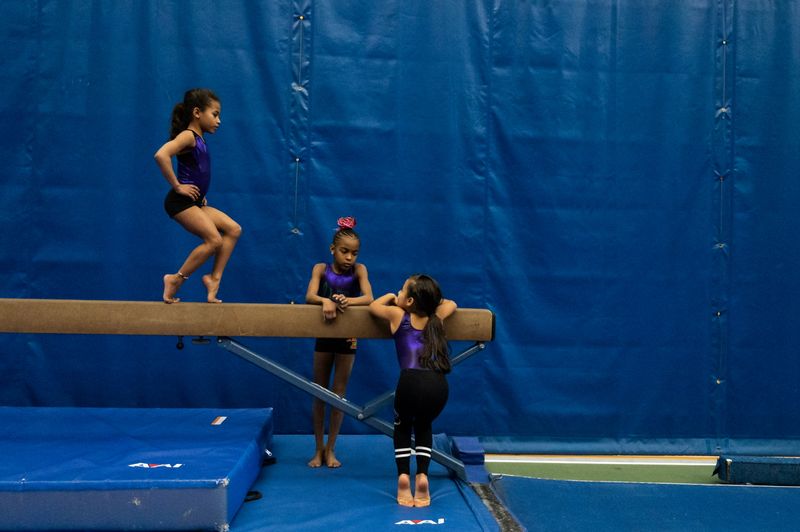 The Wider Image: In Simone Biles' path, a fearless young gymnast learns new 2020 routine