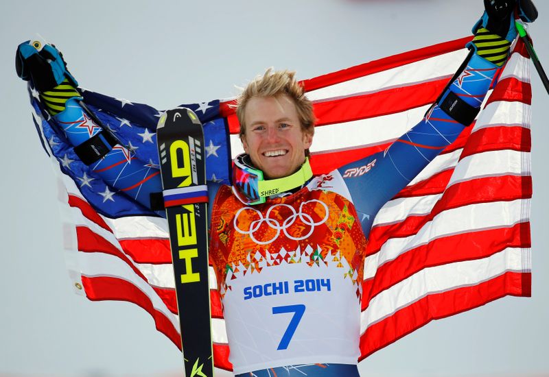 FILE PHOTO: Winner Ted Ligety of the U.S. holds up his national flag during the flower ceremony for the men's alpine skiing giant slalom event in the Sochi 2014 Winter Olympics at the Rosa Khutor Alpine Center