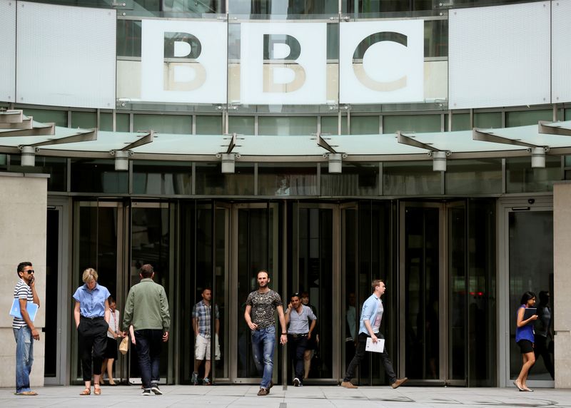 FILE PHOTO: People arrive and depart from Broadcasting House, the headquarters of the BBC in London