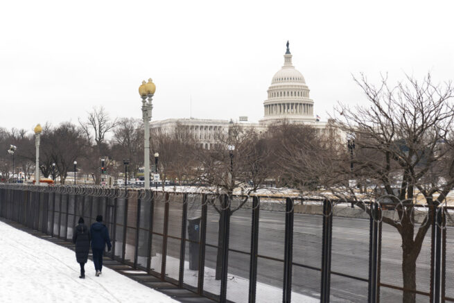 The U.S. Capitol is seen behind the metal security fencing Thursday, Feb. 18, 2021, in Washington. U.S. Capitol Police officials told congressional leaders the razor-wire topped fencing around the Capitol should remain in place for several more months as law enforcement continues to track threats against lawmakers, a person familiar with the matter told The Associated Press. (AP Photo/Manuel Balce Ceneta)