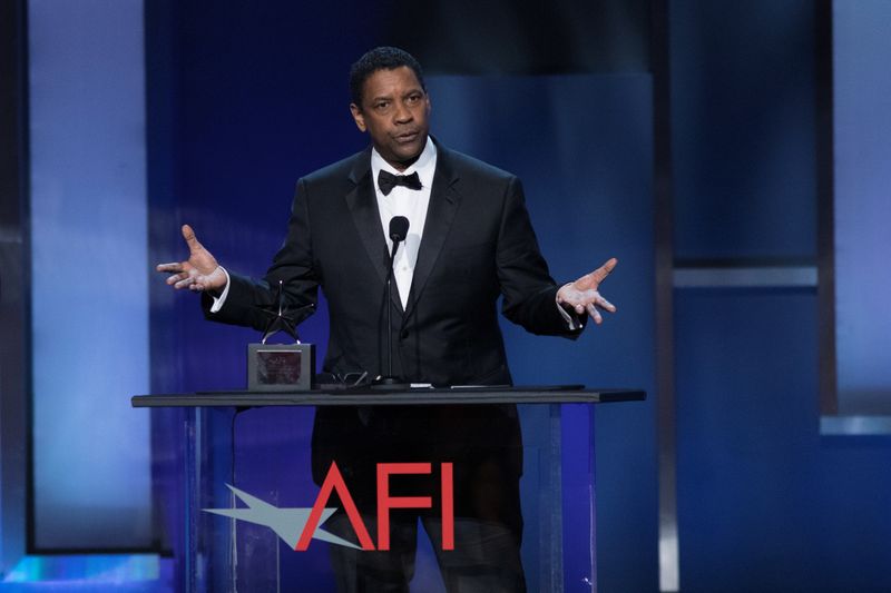 FILE PHOTO: Actor Denzel Washington accepts the 47th AFI Life Achievement Award at the gala honoring him in Los Angeles