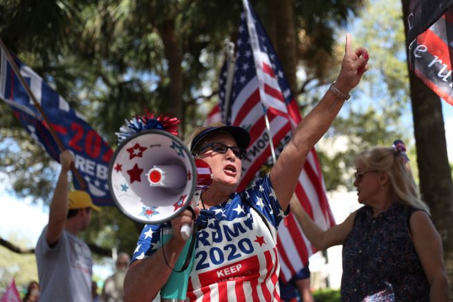  ORLANDO, FLORIDA - FEBRUARY 28: Marcia English shows her support for former President Donald Trump outside of the Hyatt Regency, where the Conservative Political Action Conference is being held on February 28, 2021 in Orlando, Florida. Mr. Trump is scheduled to speak at the convention. Begun in 1974, CPAC brings together conservative organizations, activists, and world leaders to discuss issues important to them. (Photo by Joe Raedle/Getty Images)