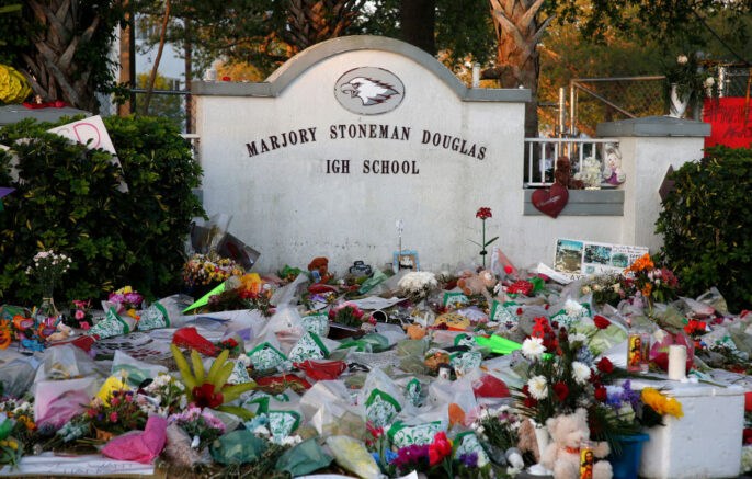 Flowers, candles and mementos sit outside one of the makeshift memorials at Marjory Stoneman Douglas High School in Parkland, Florida on February 27, 2018. Florida's Marjory Stoneman Douglas high school will reopen on February 28, 2018 two weeks after 17 people were killed in a shooting by former student, Nikolas Cruz, leaving 17 people dead and 15 injured on February 14, 2018. / AFP PHOTO / RHONA WISE (Photo credit should read RHONA WISE/AFP via Getty Images)