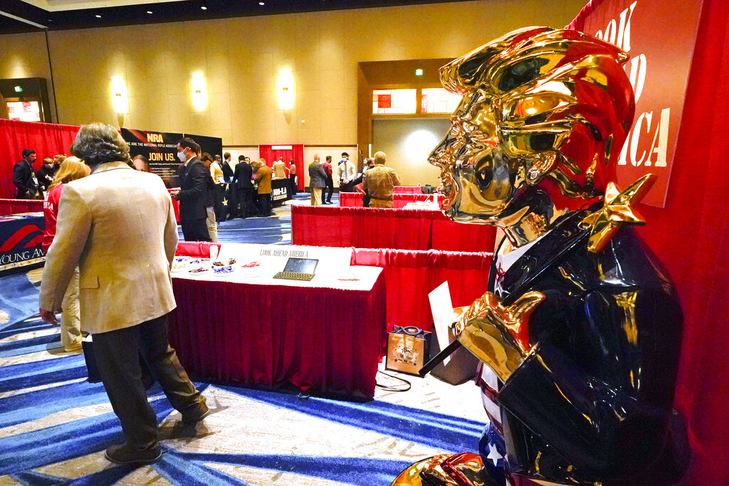  A statue of former president Donald Trump on display at the merchandise show at the Conservative Political Action Conference (CPAC) Friday, Feb. 26, 2021, in Orlando, Fla. (AP Photo/John Raoux)