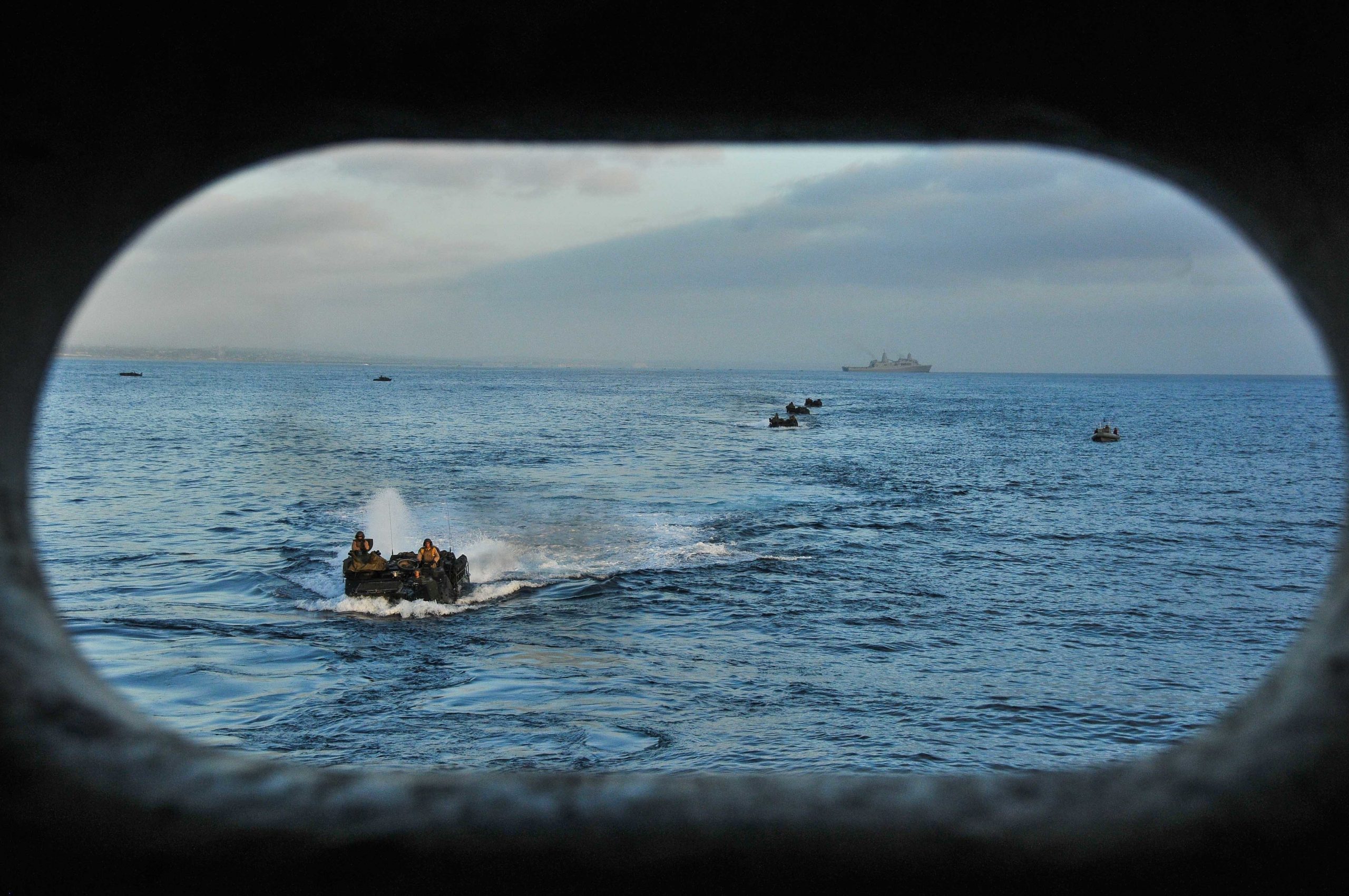 150831-N-WK391-032 PACIFIC OCEAN (August 31,2015) Amphibious assault vehicles prepare to enter the well deck of the amphibious transport dock ship USS New Orleans (LPD 18), during Exercise Dawn Blitz 2015 (DB-15). DB-15, being conducted from Aug. 31- Sept. 9, 2015 by Expeditionary Strike Group 3 (ESG-3) and 1st Marine Expeditionary Brigade (1stMEB), is a multinational training exercise between the U.S., Japan, Mexico and New Zealand which conducts live, simulated, and constructive operations to enhance each country’s ability to activate and deploy an Amphibious Task Force with speed and effectiveness in support of the full range of military operations as required by combatant commanders. (U.S. Navy photo by Mass Communications Specialist 3rd Class Brandon Cyr/Released)