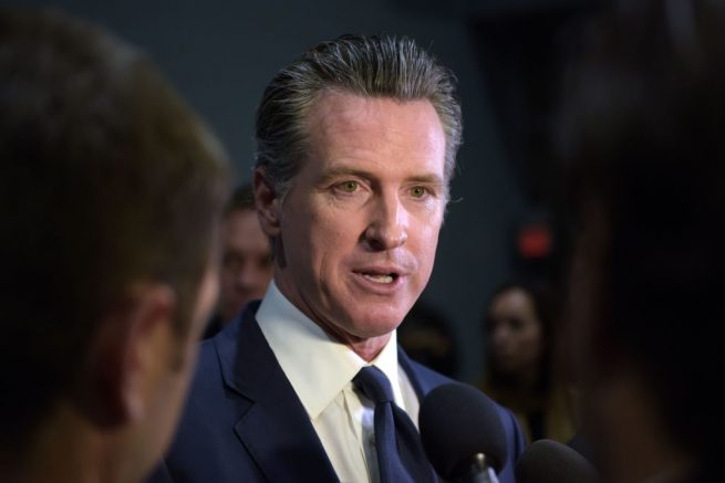 California Governor Gavin Newsom speaks to the press in the spin room after the sixth Democratic primary debate of the 2020 presidential campaign season co-hosted by PBS NewsHour &amp; Politico at Loyola Marymount University in Los Angeles, California on December 19, 2019. (Photo by Agustin PAULLIER / AFP) (Photo by AGUSTIN PAULLIER/AFP via Getty Images)