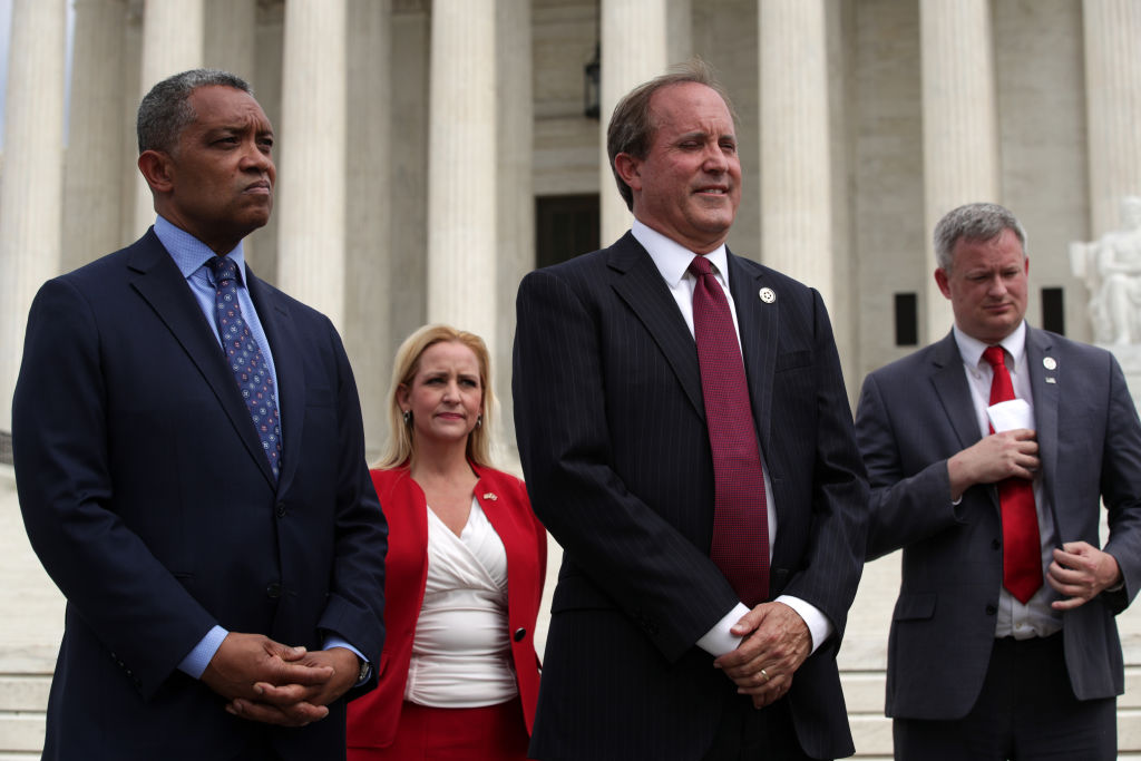 WASHINGTON, DC - SEPTEMBER 09: (L-R) Washington, DC Attorney General Karl Racine, Arkansas Attorney General Leslie Rutledge, Texas Attorney General Ken Paxton and South Dakota Attorney General Jason Ravnsborg listen during a news conference in front of the U.S. Supreme Court September 9, 2019 in Washington, DC. Fifty state attorneys general are joining together to investigate Google’s possible antitrust violations. (Photo by Alex Wong/Getty Images)