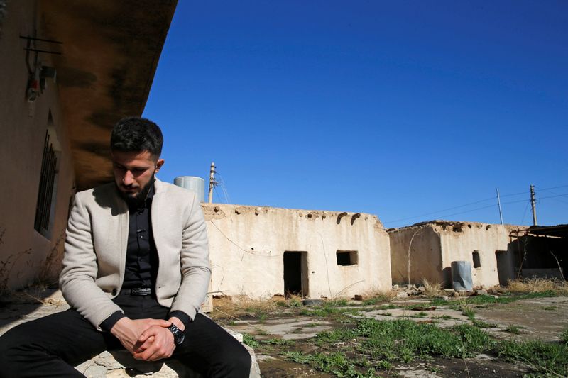 Thikran Kamiran Yousif, 22, is seen during an interview with Reuters at his grandfather's house which was destroyed in past Islamic State militant attacks, in Kojo