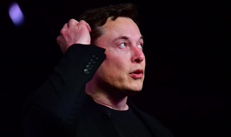 Tesla drops as much as 13%, turns negative for the year