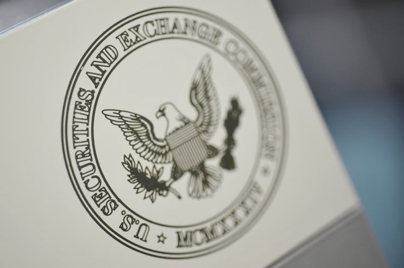 FILE PHOTO: FILE PHOTO: The U.S. Securities and Exchange Commission logo adorns an office door
