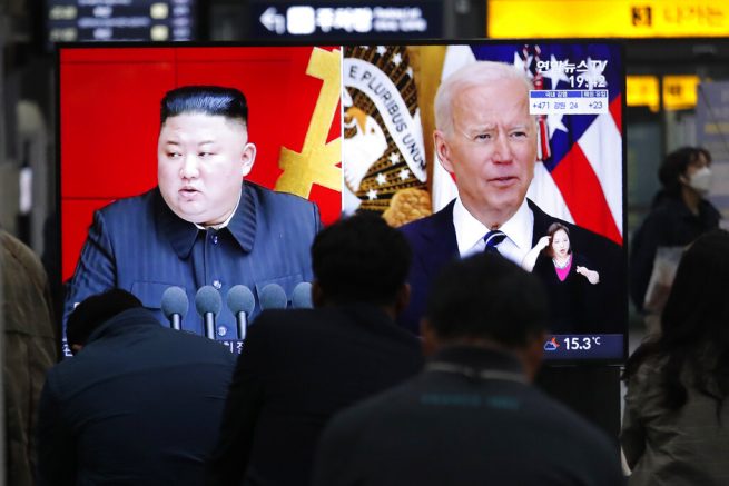 Commuters watch a TV showing a file image of North Korean leader Kim Jong Un and U.S. President Joe Biden during a news program at the Suseo Railway Station in Seoul, South Korea, Friday. March 26, 2021. North Korea on Friday confirmed it had tested a new guided missile, as Biden warned of consequences if Pyongyang escalates tensions amid stalled nuclear negotiations. (AP Photo/Ahn Young-joon)