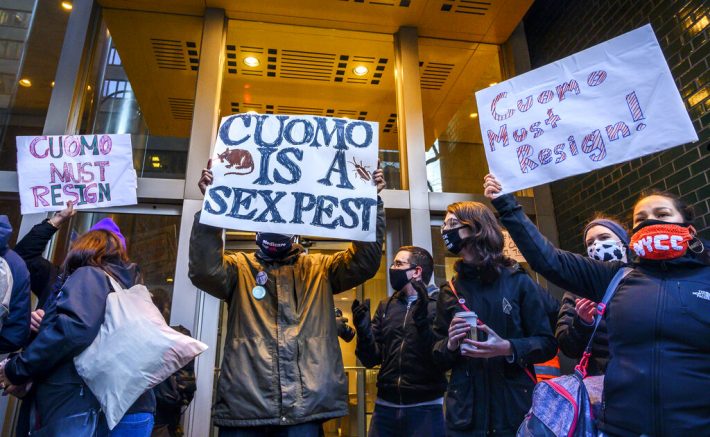 Demonstrators rally for New York Gov. Andrew Cuomo's resignation in front of his Manhattan office in New York, Tuesday, March 2, 2021. Cuomo has avoided public appearances for days as some members of his own party call for him to resign over sexual harassment allegations. (AP Photo/Brittainy Newman)