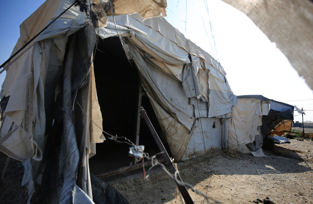 An empty tent is pictured at a displaced persons camp in Habbaniyah in Iraq's Anbar province on November 10, 2020. - After five years hosting displaced Iraqis, the vast camp was emptied in under 48 hours. The Habbaniyah Tourist Camp, a former luxury resort used to house Iraqis fleeing the Islamic State group, closed this week as part of a sudden government push to shutter dozens of displacement camps by the end of the year. (Photo by AHMAD AL-RUBAYE / AFP) (Photo by AHMAD AL-RUBAYE/AFP via Getty Images)