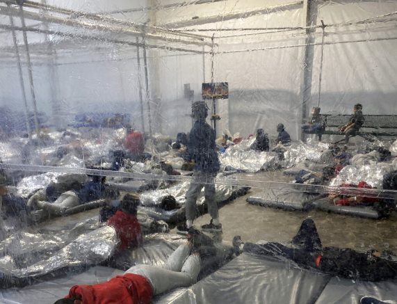 This March 20, 2021, photo provided by the Office of Rep. Henry Cuellar, D-Texas, shows detainees in a Customs and Border Protection (CBP) temporary overflow facility in Donna, Texas. President Joe Biden's administration faces mounting criticism for refusing to allow outside observers into facilities where it is detaining thousands of immigrant children. (Photo courtesy of the Office of Rep. Henry Cuellar via AP)