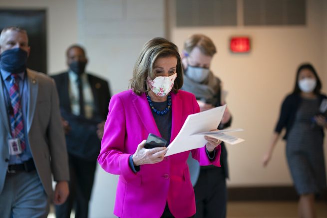 Speaker of the House Nancy Pelosi, D-Calif., walks to a news conference as the Democratic-led House is poised to pass a bill that enshrines protections in the nation's labor and civil rights laws for LGBTQ people, a top priority of President Joe Biden, at the Capitol in Washington, Thursday, Feb. 25, 2021. (AP Photo/J. Scott Applewhite)