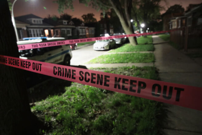 CHICAGO, IL - MAY 27: Crime scene tape is stretched around the front of a home where a man was shot on May 28, 2017 in Chicago, Illinois. Chicago police have added more than 1,000 officers to the streets over the Memorial Day weekend, hoping to put a dent in crime, during what is typically one of the more violent weekends of the year. In 2016, 6 people were killed and another 65 were wounded by gun violence over the Memorial Day weekend. (Photo by Scott Olson/Getty Images)