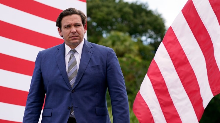 Florida Gov. Ron DeSantis attends an event with President Donald Trump on the environment at the Jupiter Inlet Lighthouse and Museum, Tuesday, Sept. 8, 2020, in Jupiter, Fla. (AP Photo/Evan Vucci)