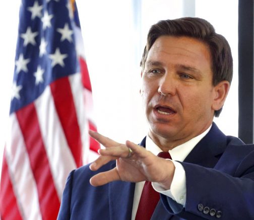 Florida Gov. Ron DeSantis answers a question during a news conference announcing the Resiliency Florida initiative, at the Amway Center in Orlando, Fla., Friday, Feb. 26, 2021. (Joe Burbank /Orlando Sentinel via AP)