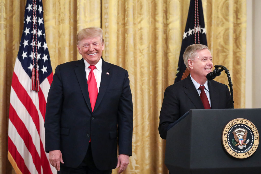 WASHINGTON, DC - NOVEMBER 6: (L-R) President Donald Trump looks on as Sen. Lindsey Graham (R-SC) speaks during an event about judicial confirmations in the East Room of the White House on November 6, 2019 in Washington, DC. More than 150 of the president's federal judicial nominees have been confirmed by the Republican-controlled Senate. (Photo by Drew Angerer/Getty Images)