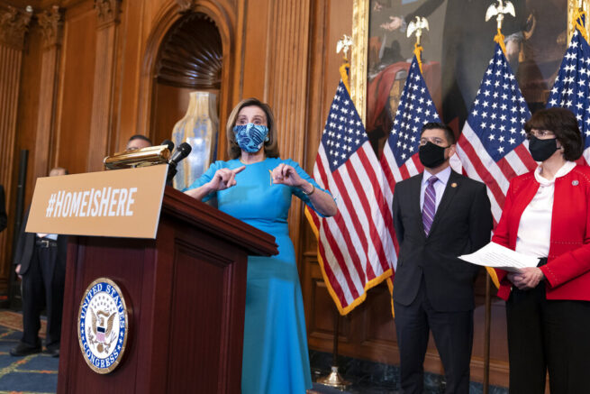 Speaker of the House Nancy Pelosi, D-Calif., joined at right by Rep. Raul Ruiz, D-Calif., chairman of the House Hispanic Caucus, and Rep. Lucille Roybal-Allard, D-Calif., discusses the upcoming vote on the American Dream and Promise Act of 2021, a bill to help reform the immigration system, at the Capitol in Washington, Thursday, March 18, 2021. (AP Photo/J. Scott Applewhite)