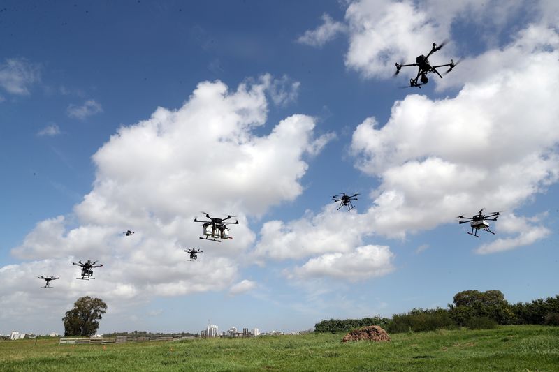 Delivery drones are seen midair during a demonstration whereby drones from various companies flew in a joint airspace and were managed by an autonomous control system in Haifa, near Hadera